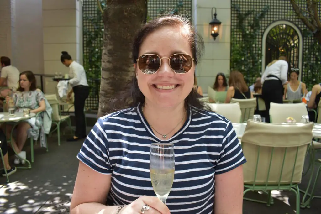 Frame Classic Linen Stripe Crew - Cats & Coffee Christine Csencsitz sipping champagne at Lauduree Soho in summer 2018.