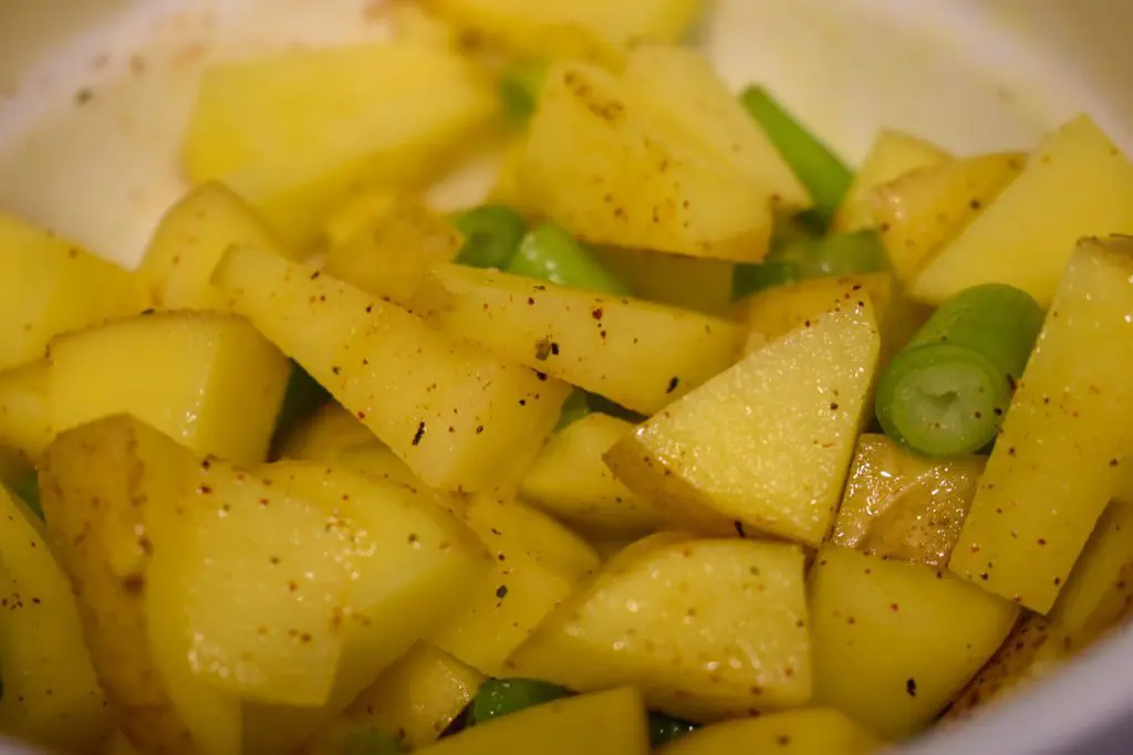 Roasted vegetables 3 - Cats & Coffee Diced potato with scallion and herbs.