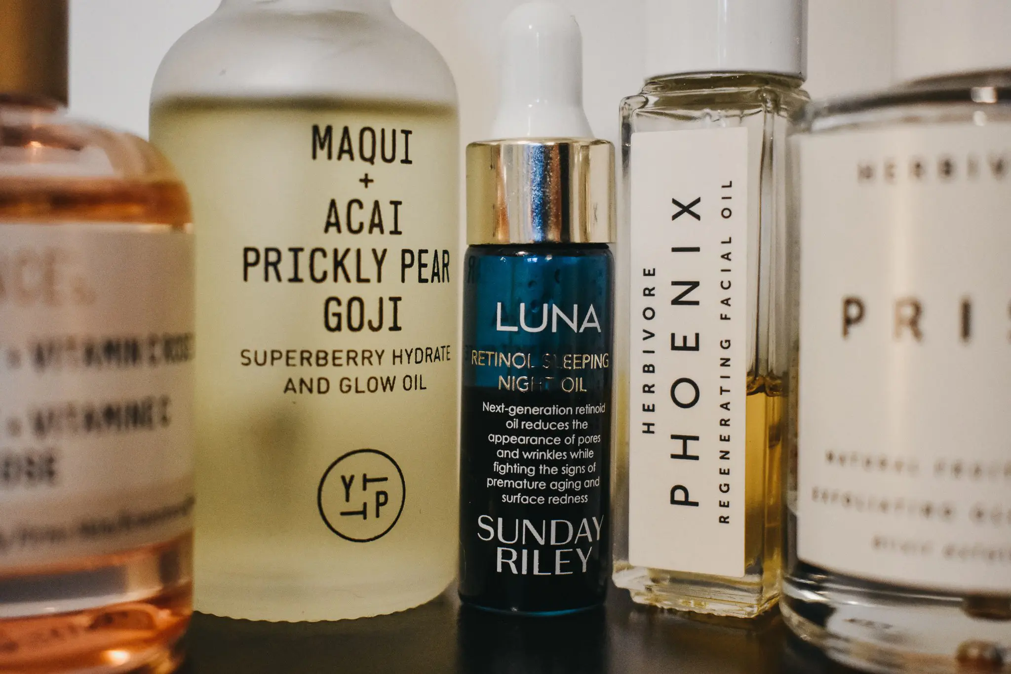 Facial OilsDSC_0013 - Cats & Coffee Facial Oils -- featuring Youth to the People Maqui + Acai Prickly Pear Goji Superberry Hydrate and Glow Oil, Sunday Riley's Luna retinol night oil, Biossance's Squalane + Vitamin C rose oil, and Herbivore products (Pheonix regenerating facial oil and prism natural fruit acid glow potion)