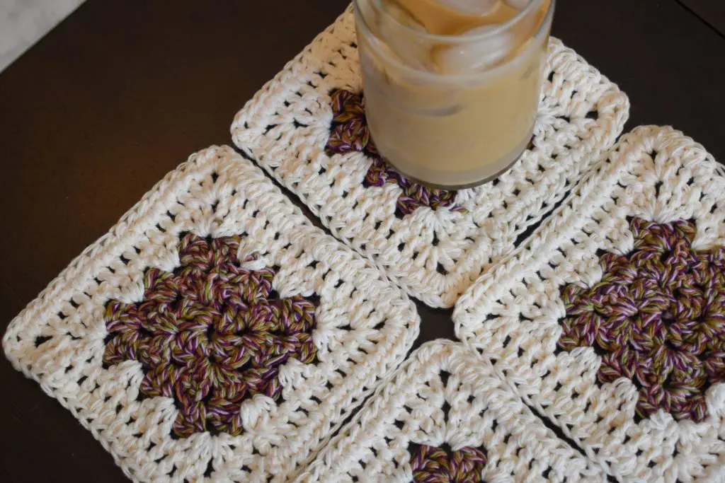 Purple-and-Cream-Coasters13-1 - Cats & Coffee Rich Purple and Cream Four Piece Granny Square Crochet Coaster Set - Made With Colorful Cotton Yarn in Purple, Pink, Burnt Orange, and Green from Critter Crafting by Christine Csencsitz