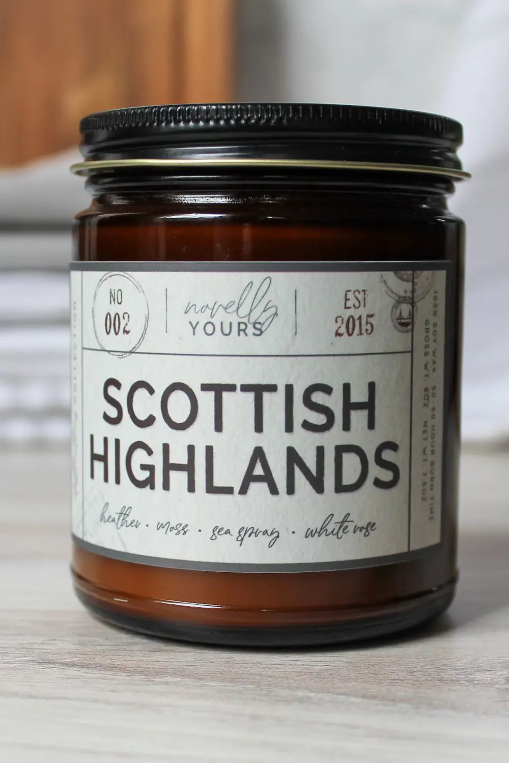 The Best Bookish Candles for Book Lovers 10 Perfect Book and Candle Pairings for a Cozy Reading Night - 1 - Cats & Coffee Scottish Highlands Candle by Novelly Yours
