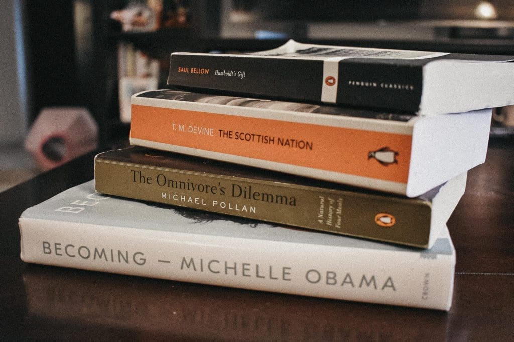 Stack of books featuring Michelle Obama's "Becoming" book, among others.