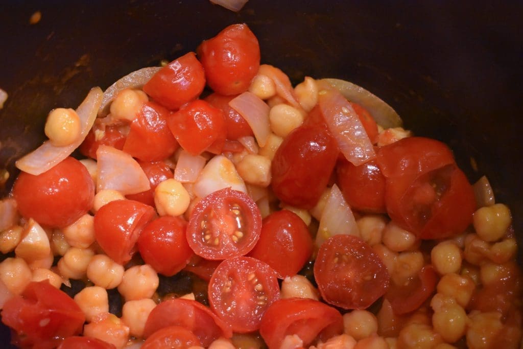 Diced cherry tomatoes, chickpeas, onions, garlic, and olive oil.