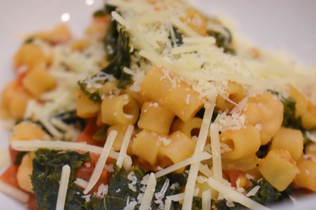 Pasta e Ceci -- ditalini pasta with cherry tomatoes, kale, chickpeas, garlic, onion, parm, and olive oil.