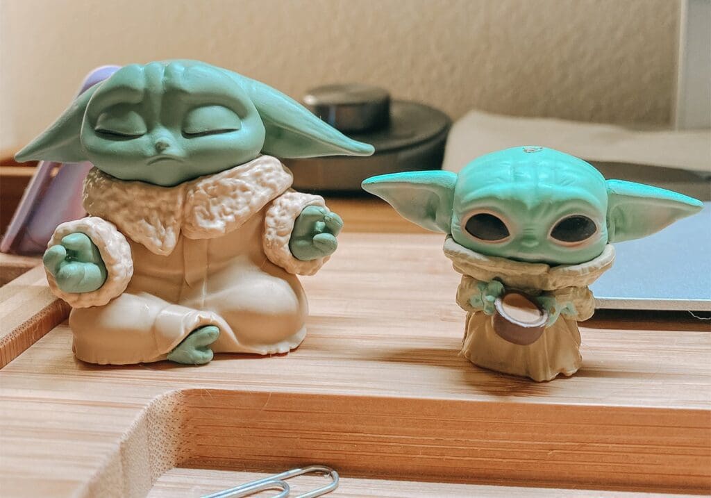 My Baby Yoda desk mates - on the left is this meditating figurine and
on the right is this keychain with the top clip removed.